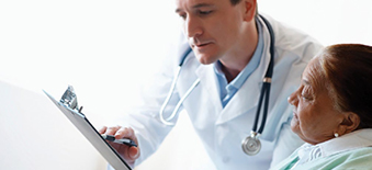 A doctor reviewing a report with his patient