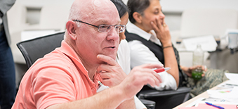 Male patient asking a question at a patient engagement meeting