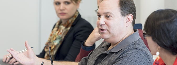 man leading a converstaion at a meeting