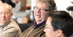 Groups of patients participating in a discussion at a Patient, Family and Caregiver Council meeting