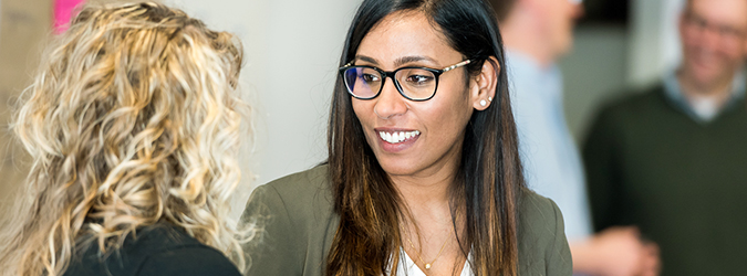 Woman having a conversation with another woman