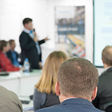 Committee members listening to a presentation