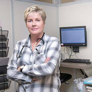 Measuring Up 2018 report cover featuring a photo of a female physician in a hospital