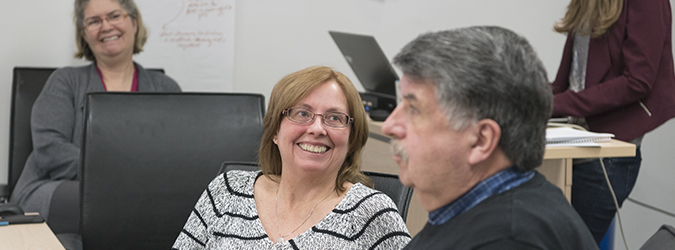 Two Regional Quality Session attendees in conversation