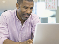 Man searching for information on his computer