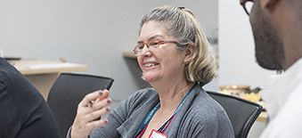 A Health Quality Ontario employee participates in a group discussion