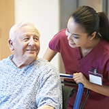 Nurse with senior patient in wheelchair