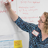 A doctor pointing at a variety of health care images