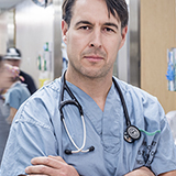 A doctor pointing at a variety of health care images