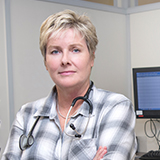 a photo of a female physician in a hospital