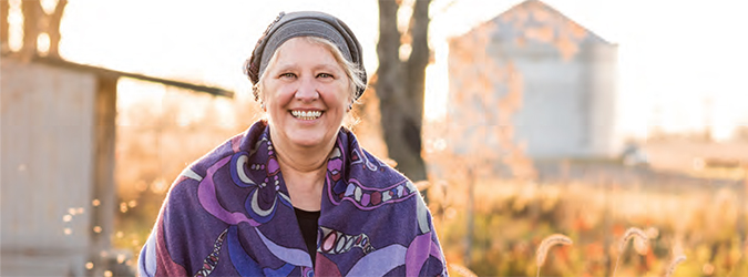 woman in a purple patterned jacket